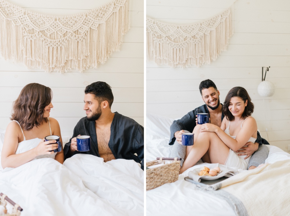 Couple eating breakfast in bed the morning of their rustic wedding in upstate New York