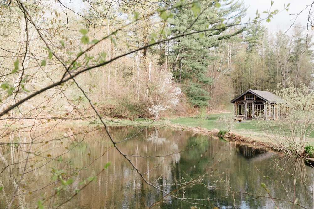 Pond and greenhouse on the grounds of Foxfire Mountain House in New York