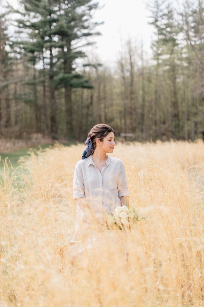 Bride in an amber field on Foxfire Mountain House's sprawling grounds by Emily Wren Photography