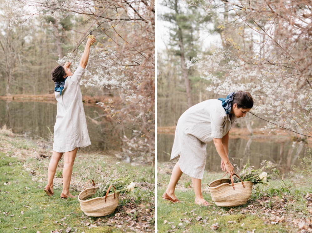 Bride foraging for wedding greenery before an intimate destination wedding in upstate New York