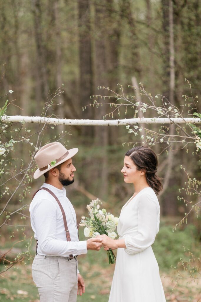 Couple exchanging vows at a intimate rustic ceremony in upstate New York