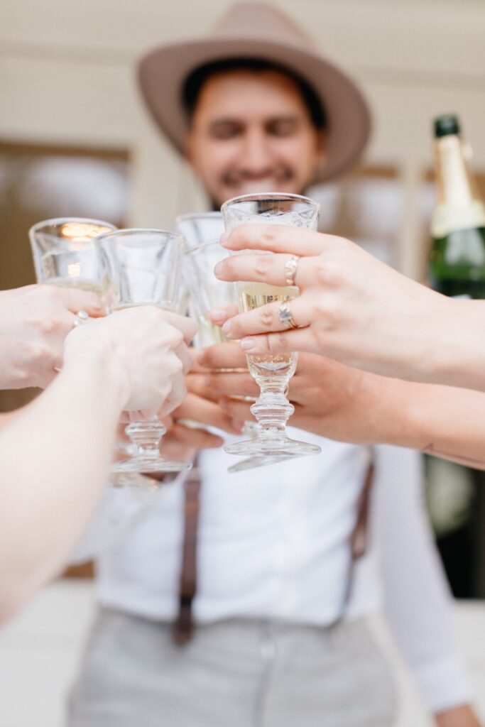 Champagne cheers after an intimate outdoor ceremony at a destination wedding at Foxfire Mountain House