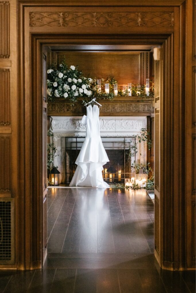 Wedding gown hanging from a fireplace at Natirar in New Jersey
