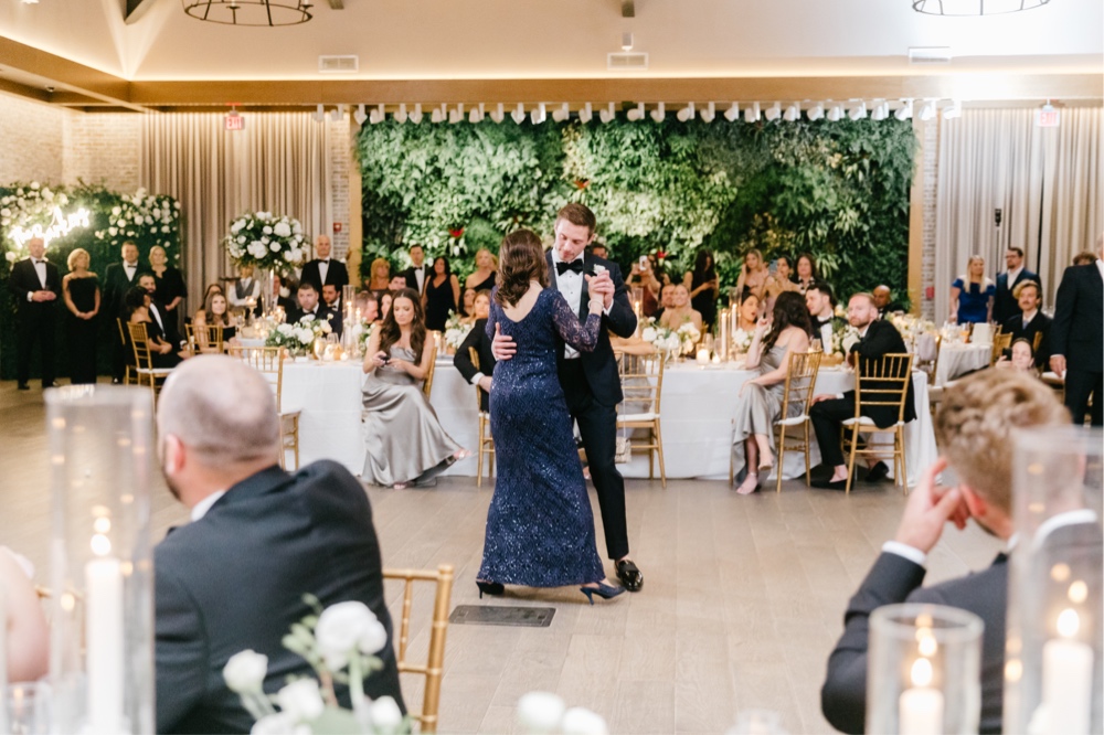 Mother of the groom and the groom share a first dance at a luxury wedding reception in NJ