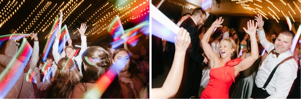 Guests partying on the dance floor at an exciting wedding reception by Emily Wren Photography