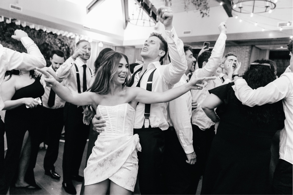 Newlyweds partying on the dance floor during a fun wedding reception at Natirar