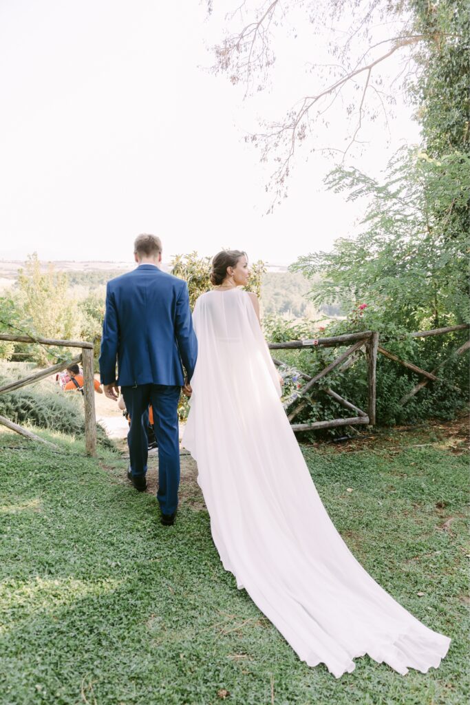 Bride with a chiffon cape at a destination wedding in Italy