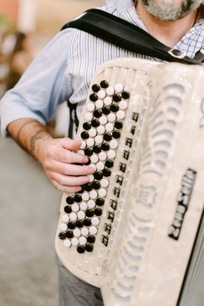 Accordian player during an enchanting destination wedding reception in Italy