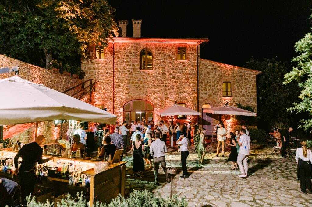 Outdoor wedding reception at The Borgo Sant'Ambrogio Estate in Tuscany by Emily Wren Photography