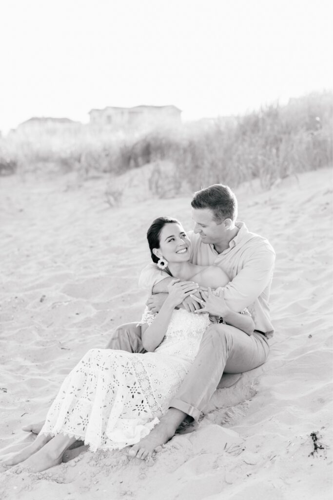 Engaged couple smiling during a beach portrait session at the Jersey Shore