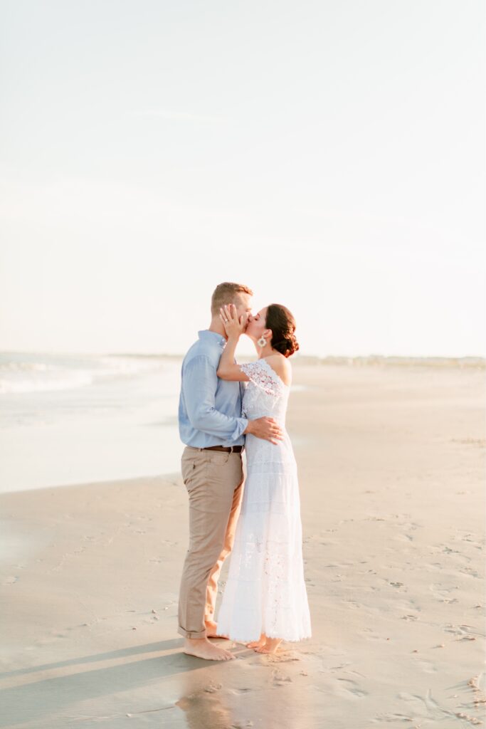 Kissing couple during a summer engagement shoot in New Jersey