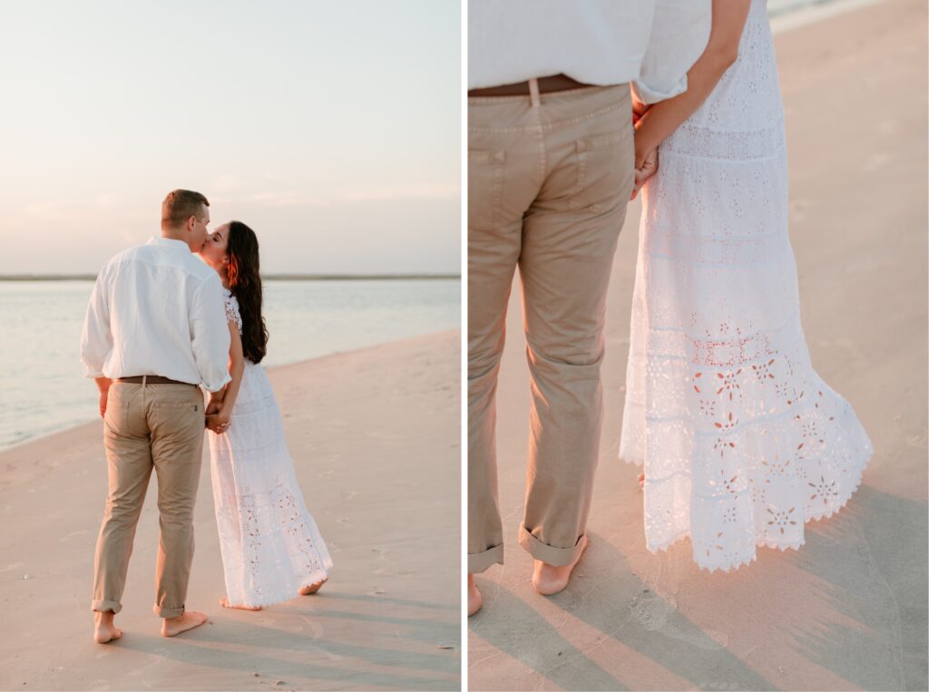 Engaged couple holding hands and kissing on the beach at sunset