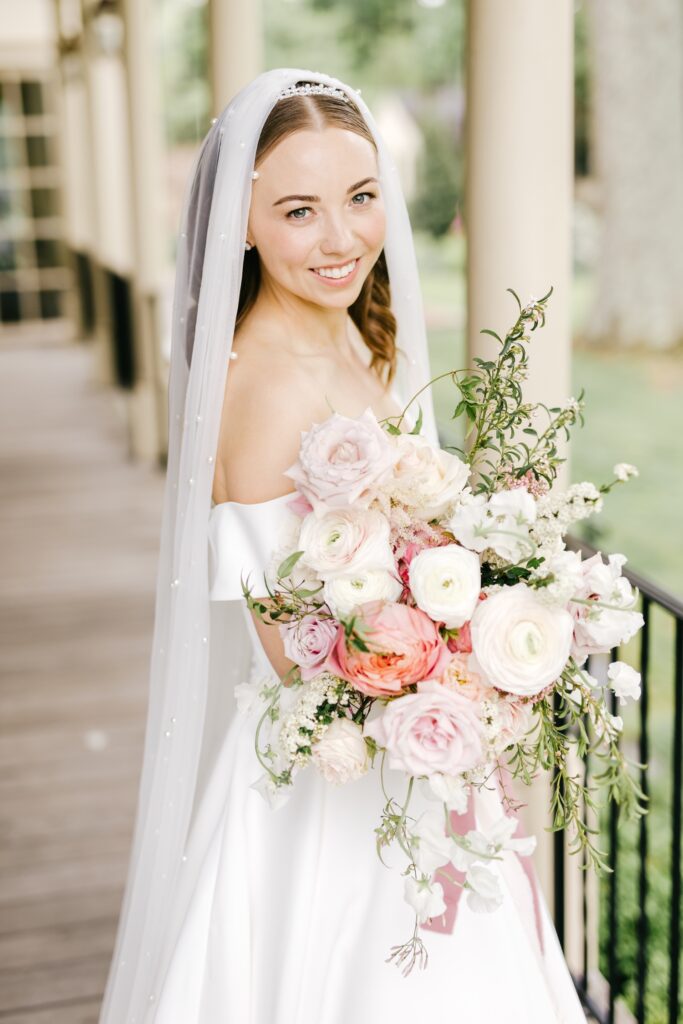 bride with her nature floral wedding bouquet