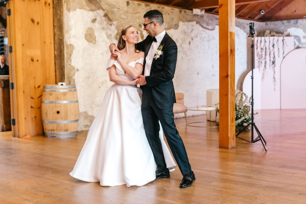 bride and groom during their first dance during their wedding reception at Grace Winery