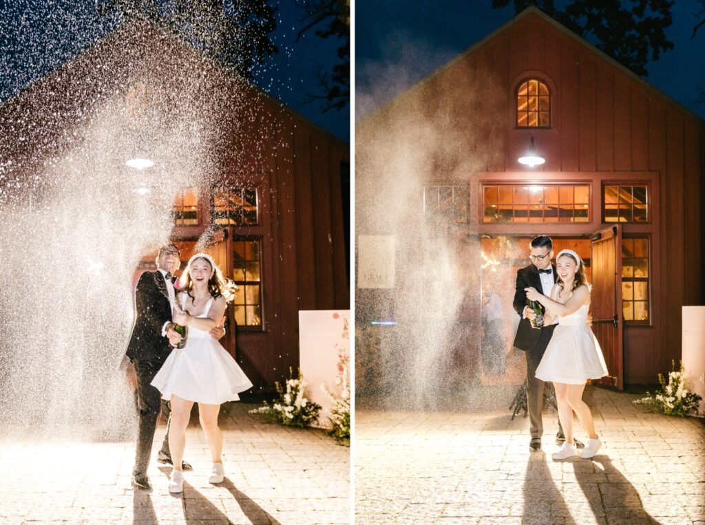 bride and groom spraying champagne at the end of their wedding reception by Emily Wren Photography
