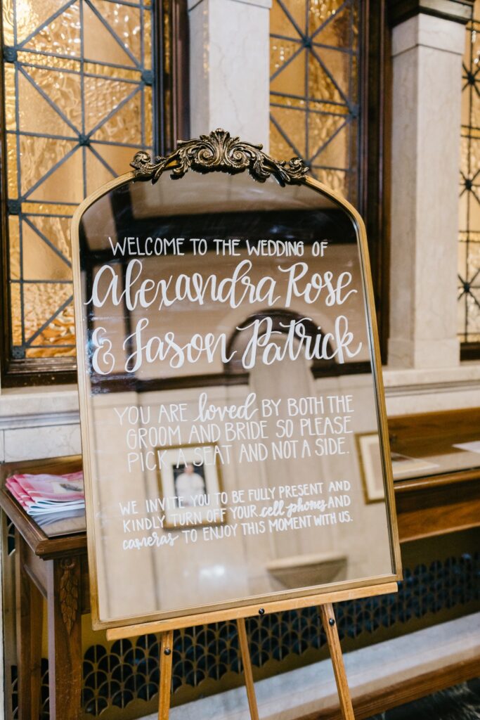 A mirrored welcome sign for an Italian-inspired wedding in Philadelphia