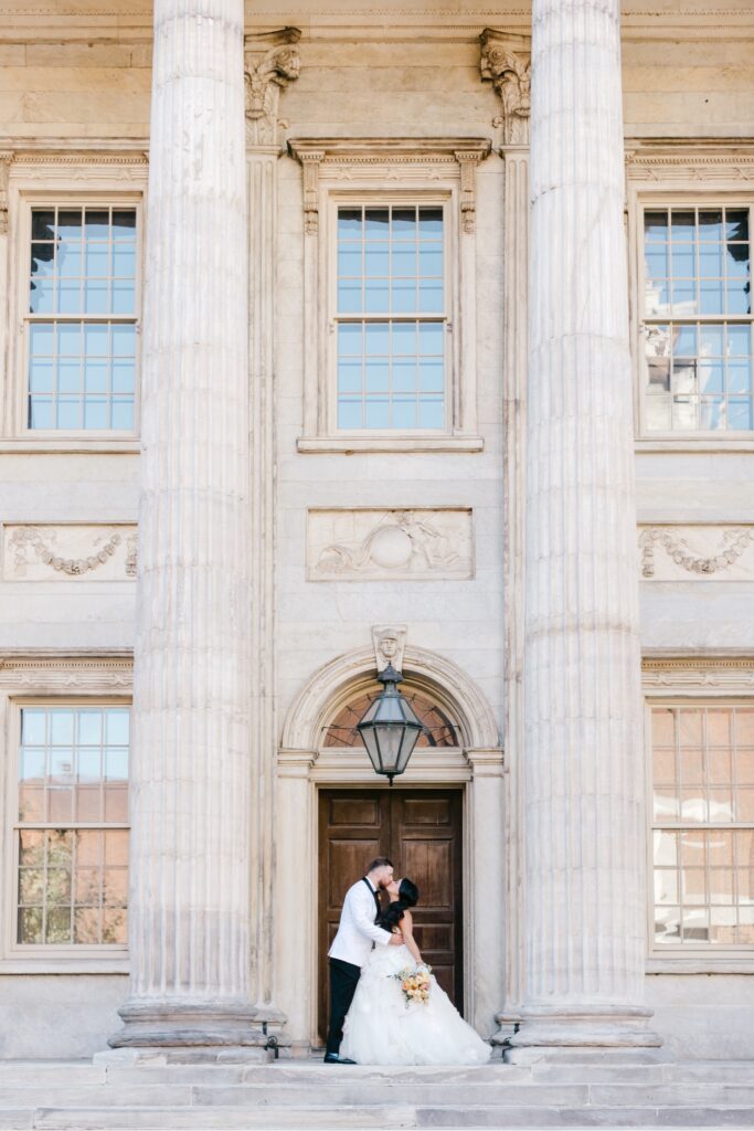 Bride and Groom kissing 2nd National Bank in Philadelphia