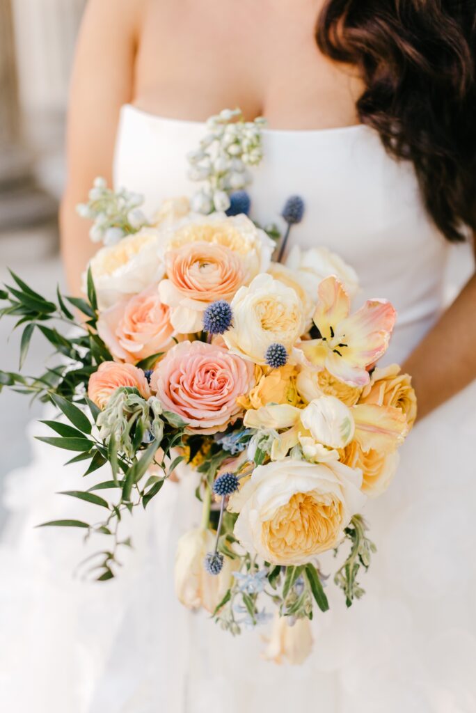 Colorful Bridal bouquet featuring coral and peach flowers