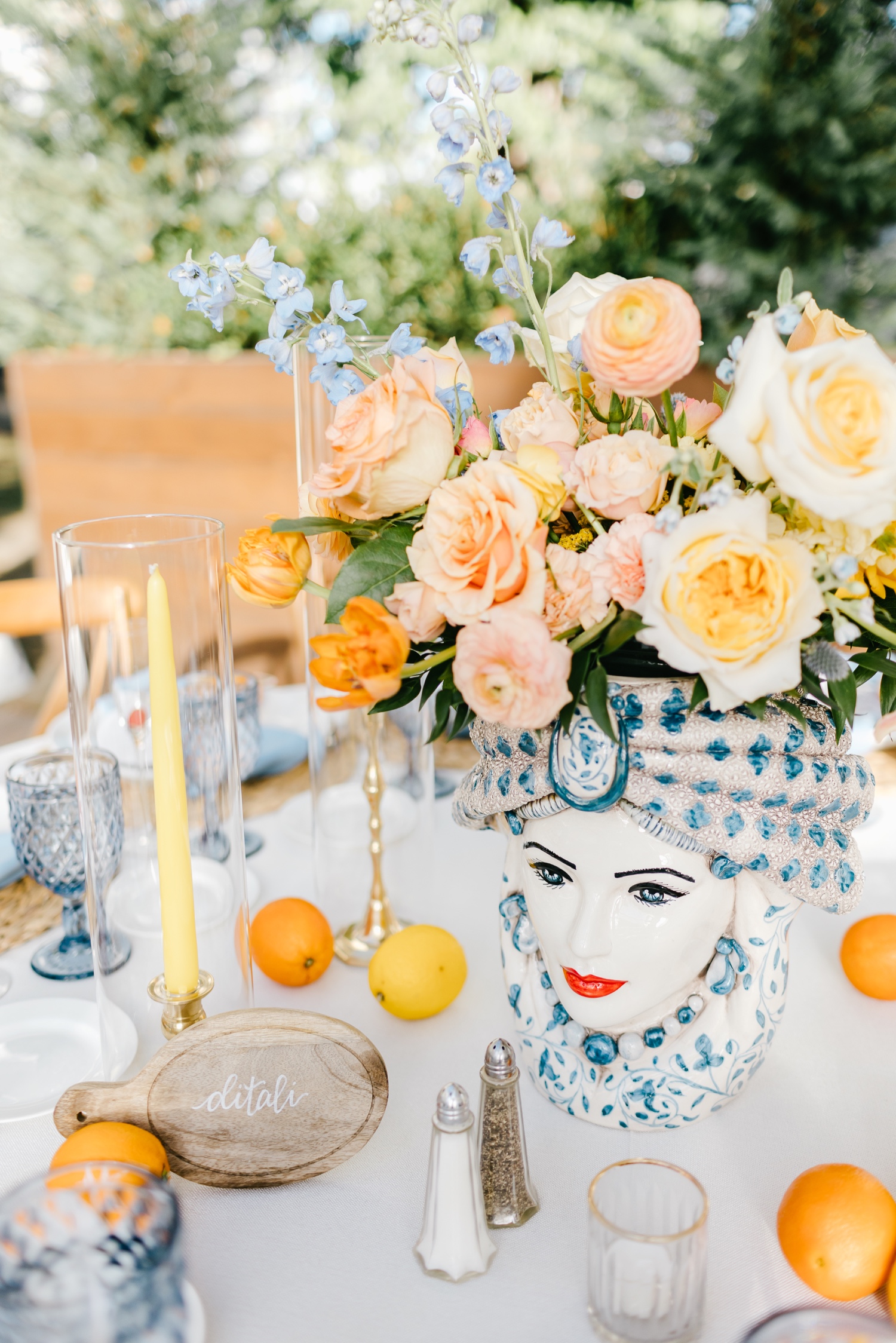 Wedding Reception decor featuring Moor-Head vase with coral, blue and peach flowers