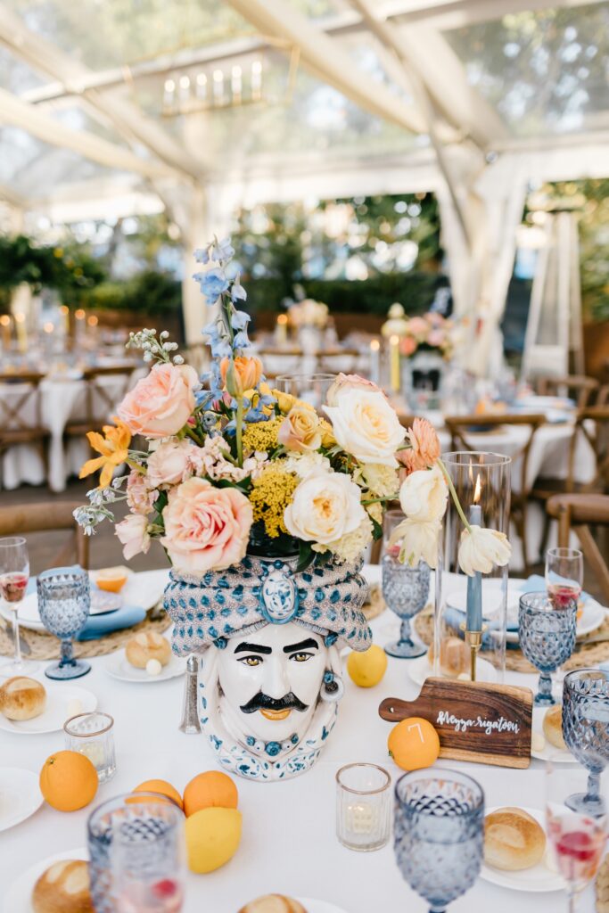 Vibrant reception table with citrus and Moor-Head vase during Philadelphia Spring Wedding