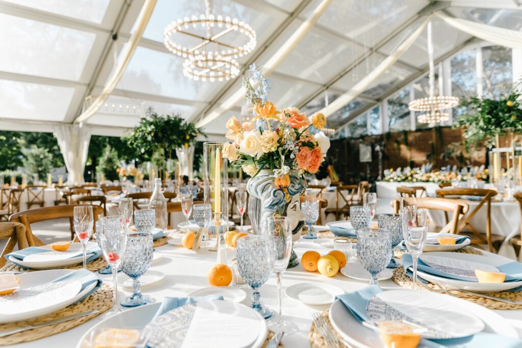 Vibrant orange and blue floral arrangement for a Spring Wedding reception