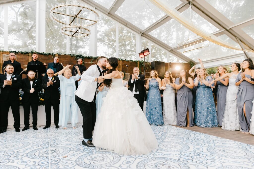 Bride and Groom's first dance on custom blue and white mosaic dance floor
