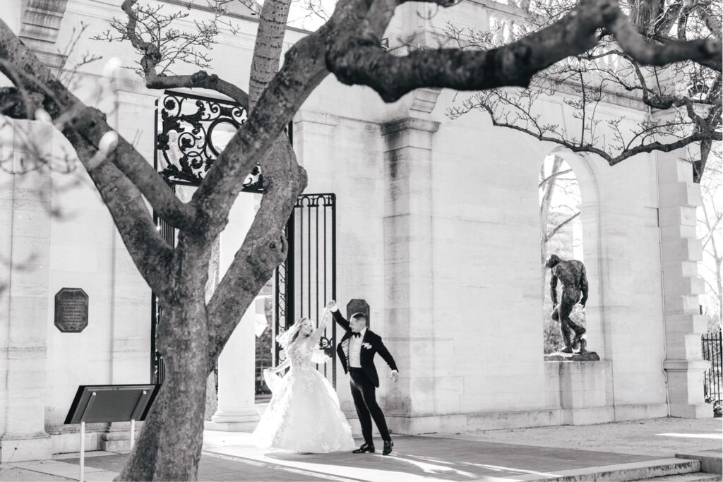 bride and groom dancing in a garden in historic Philadelphia