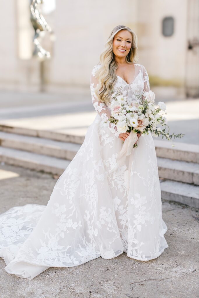 Classic bridal portrait showing off her spring inspired bridal bouquet and wedding gown with lace floral details