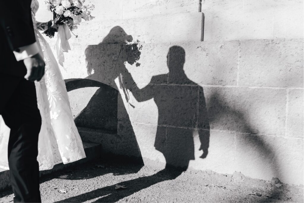 silhouette of bride and groom walking by Emily wren photography