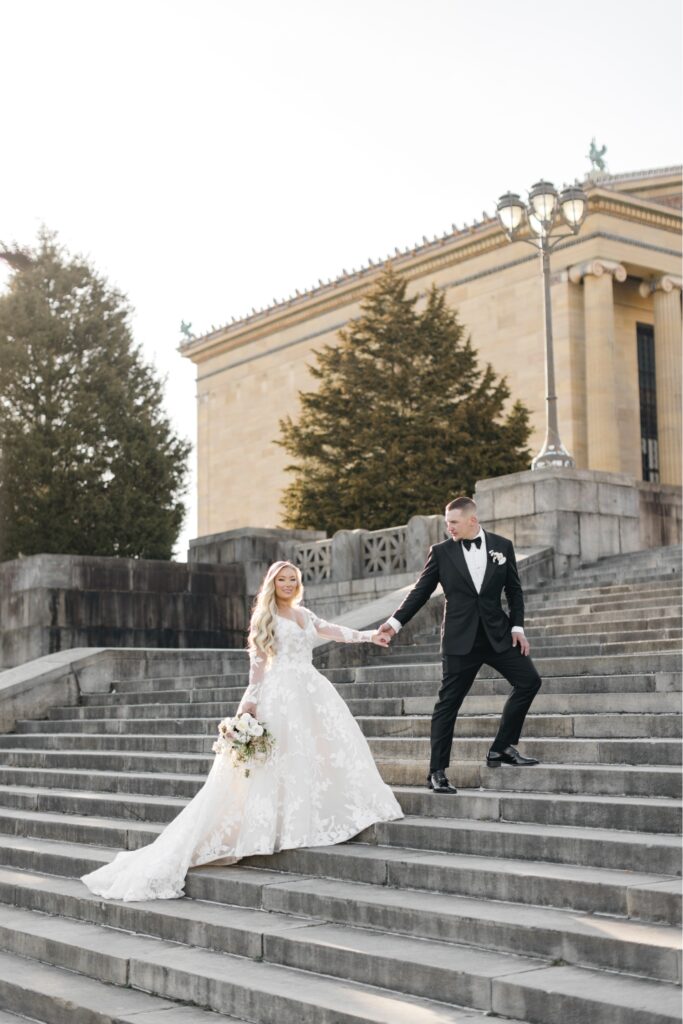 Bride and Groom walking up the Rocky Steps in Philadelphia
