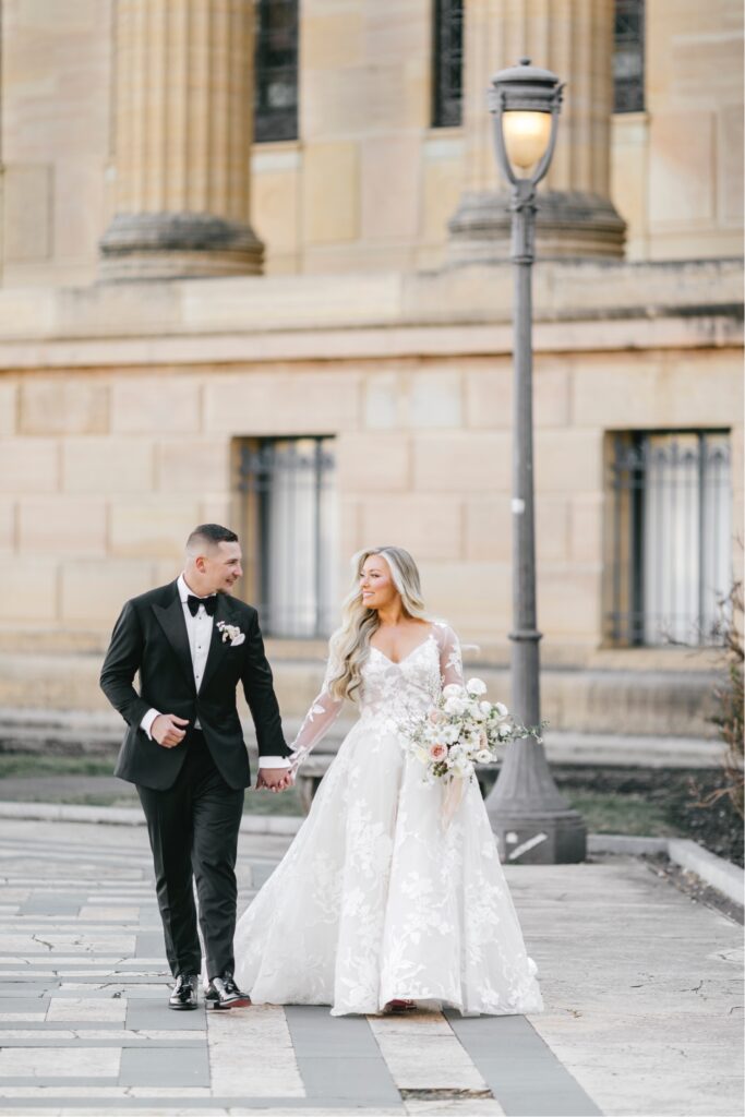 portrait of bride and groom at the Philadelphia Art Museum by Emily Wren Photography