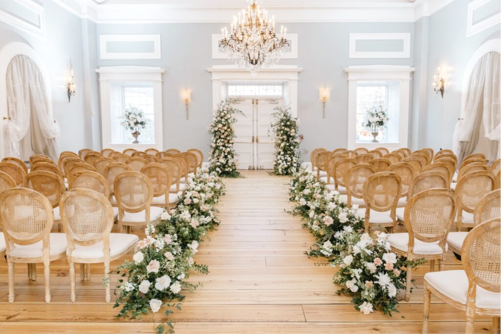 Philadelphia Waterworks wedding ceremony with floral arrangements leading up the aisle