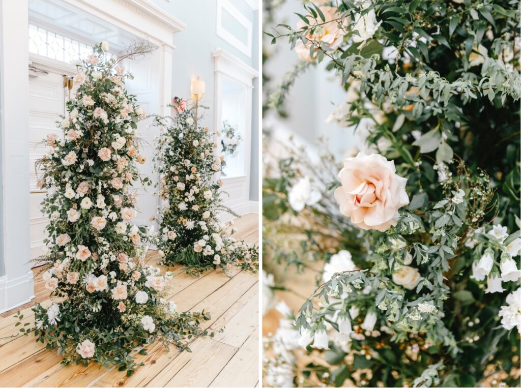 Floral and greenery wedding arch featuring pink and white spring blooms