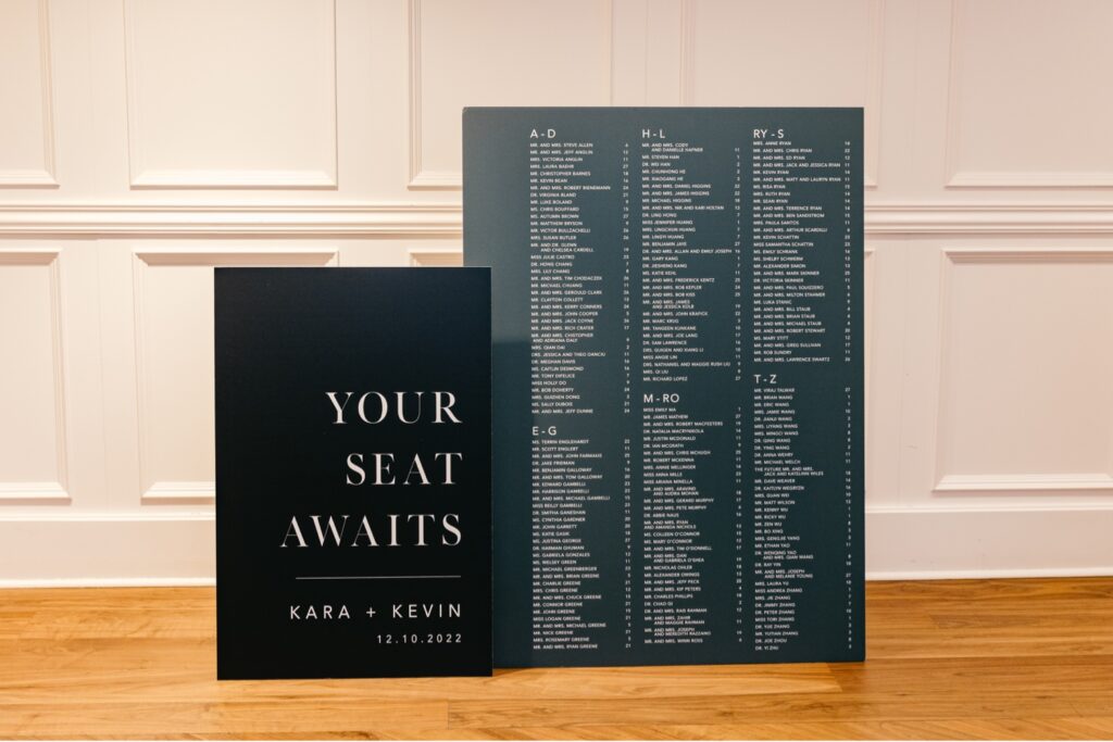 sleek black seating chart for Classic Christmas wedding reception