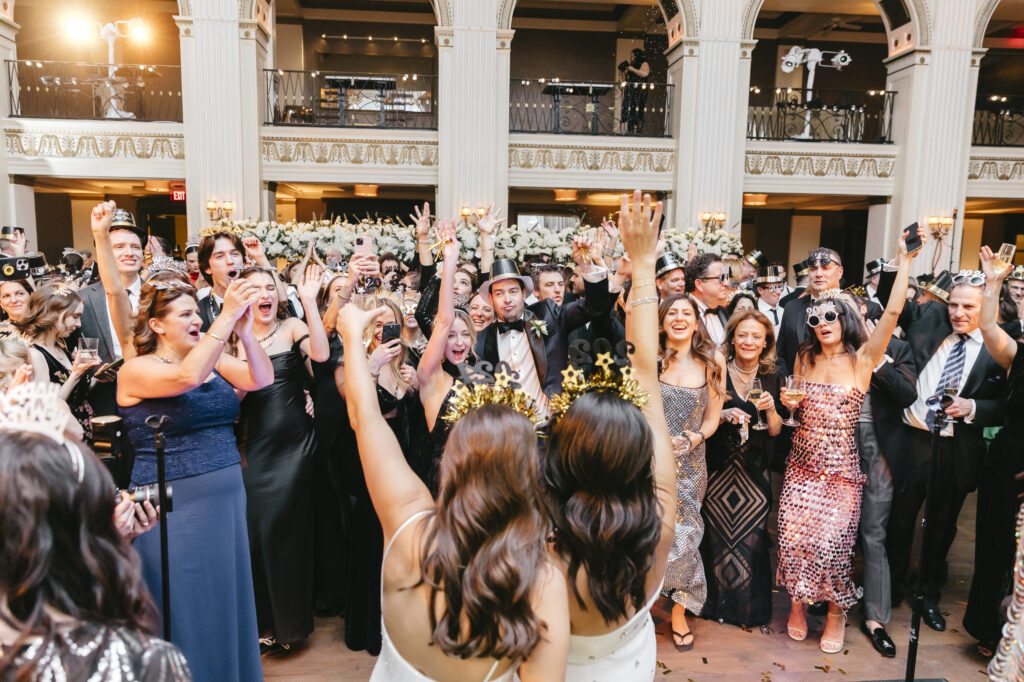 wedding guests counting down to the new year at Philadelphia New Years Eve wedding reception by Emily Wren Photography