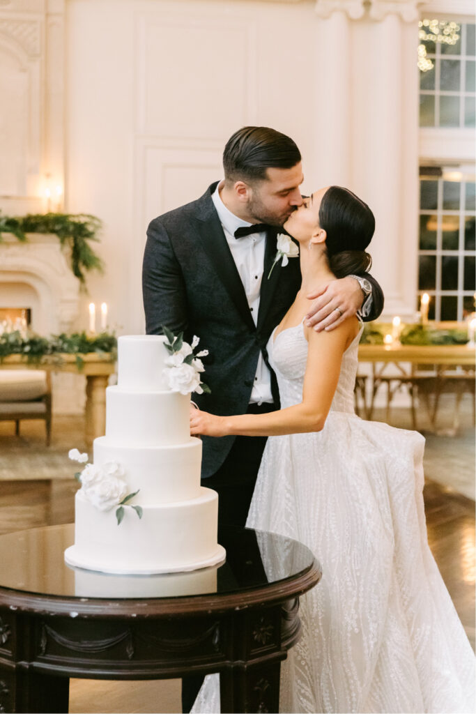 bride and groom cutting their minimalist 4 tier wedding cake