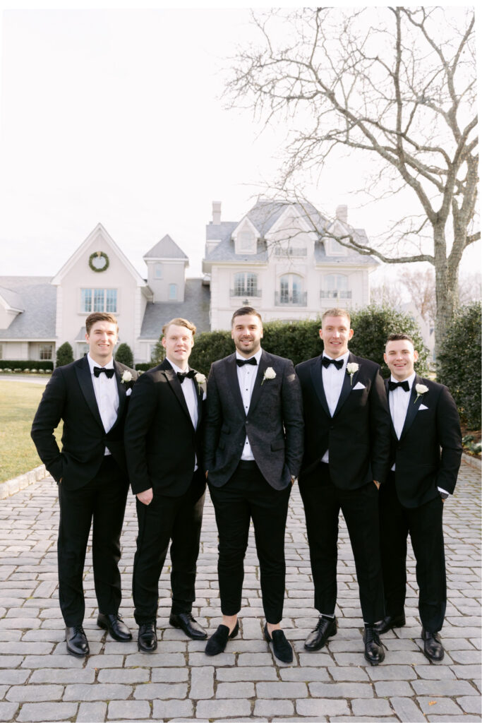 groom with groomsmen outside Park Chateau in East Brunswick New Jersey