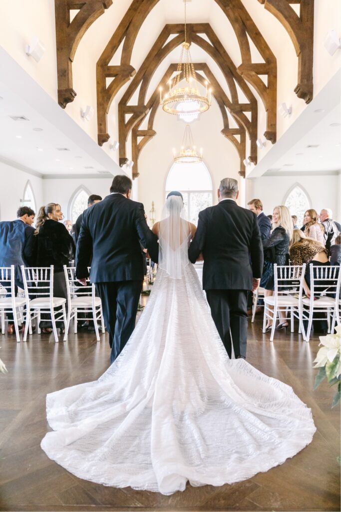 bride walking down the aisle at Park Chateau Chapel