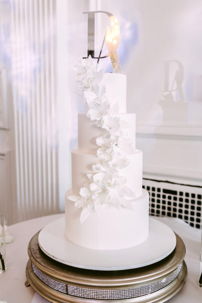 4 tier wedding cake with floral decorations