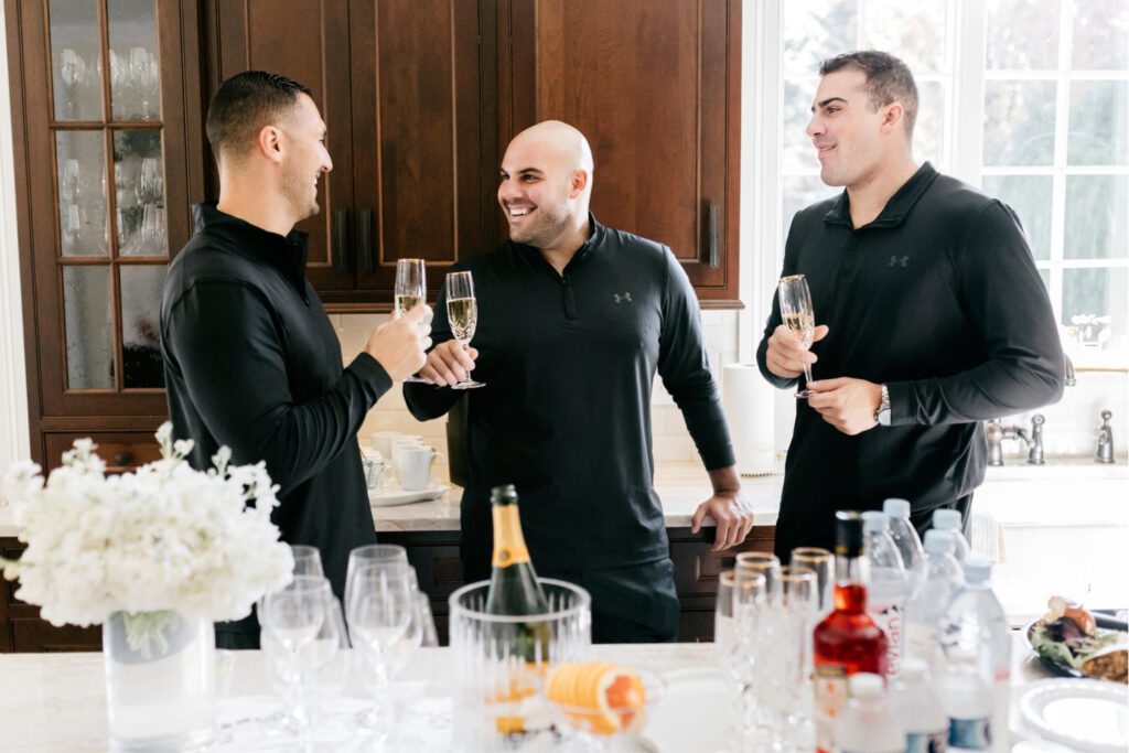 groom drinking with his groomsmen before his fall wedding in New Jersey