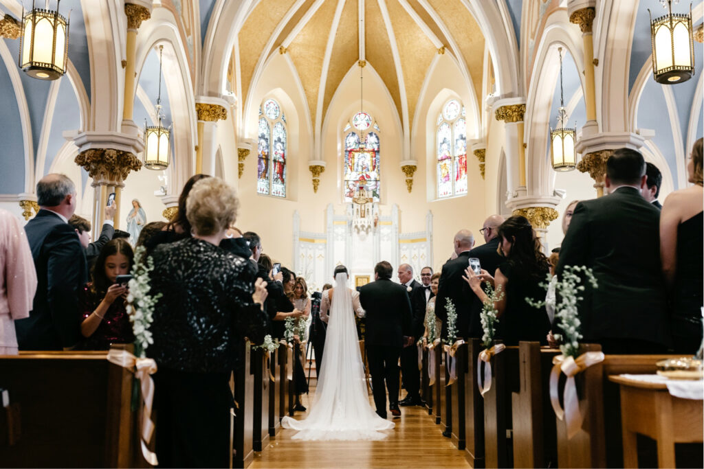 bride walking down the aisle at Our Lady of Good Counsel Church in New Jersey