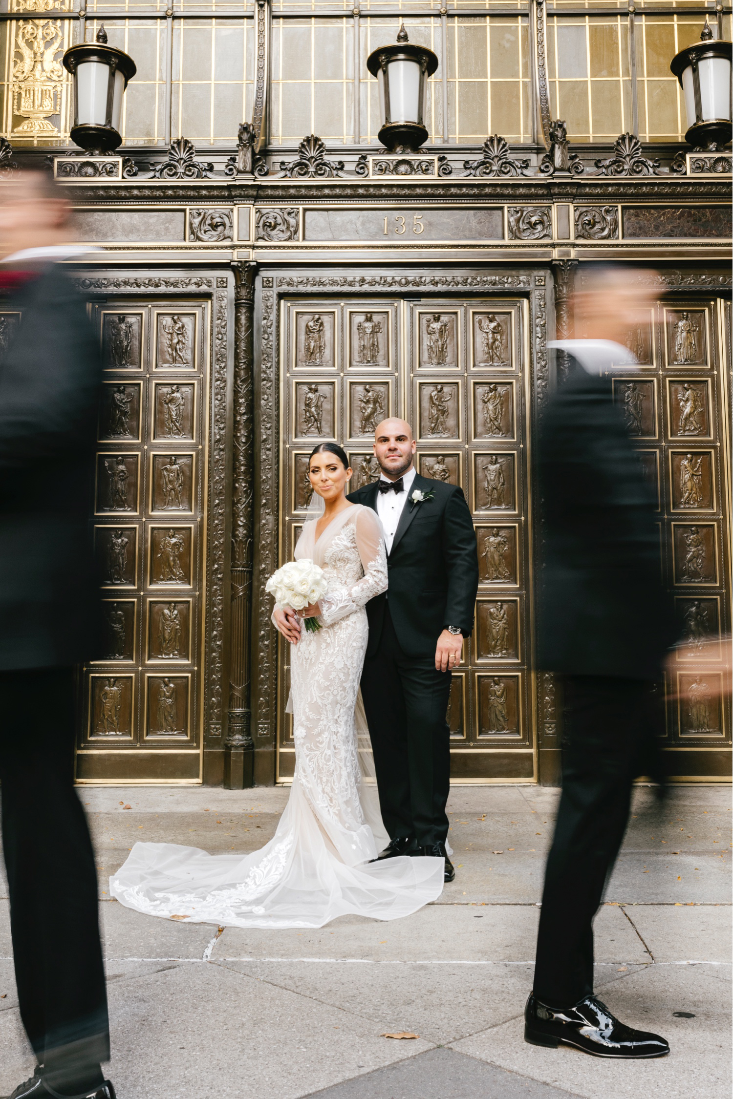 Bride and groom portrait on broad street in Center City Philadelphia By Emily Wren Photography