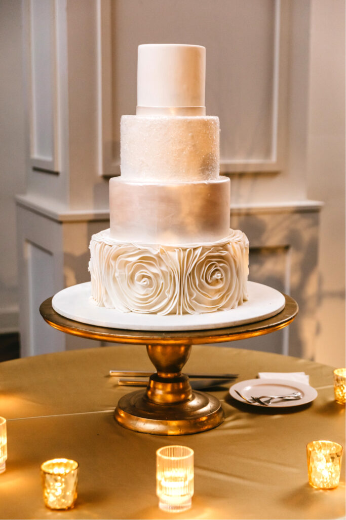 4 tier wedding cake with floral piping