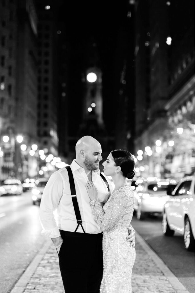 bride and groom portrait in front of City Hall by Emily Wren Photography