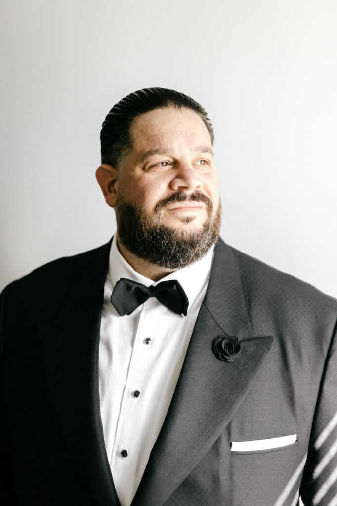 portrait of the groom before his late summer wedding day in Philadelphia