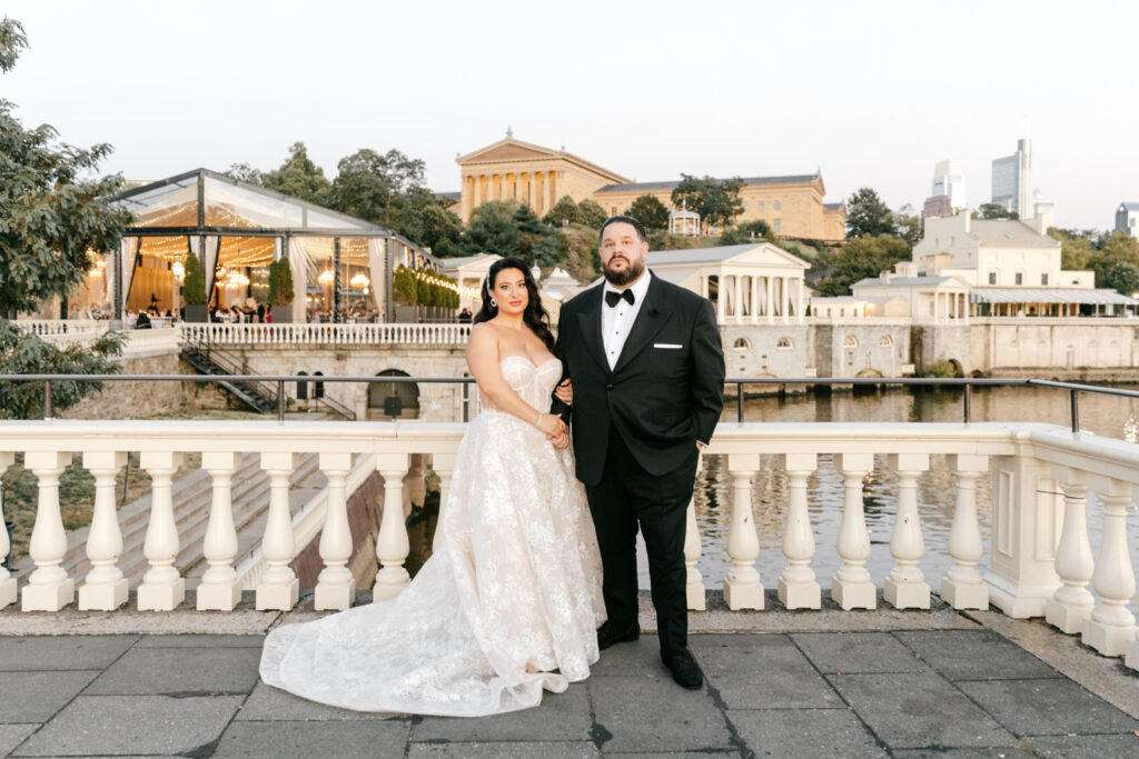 bride & groom in front of Philadelphia Museum of Art for their Cescaphe Water Works wedding by Emily Wren Photography