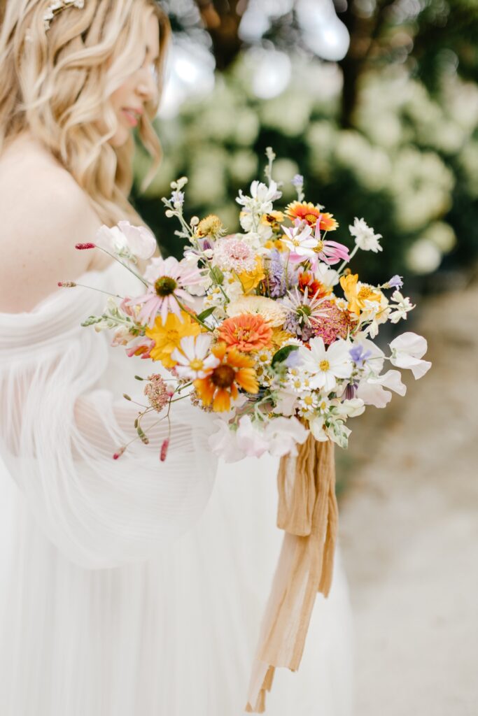 summer bridal bouquet of blue, orange, purple, white & pink flowers