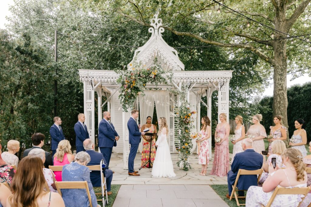 outdoor garden wedding ceremoyn at Terrain at Styer's by PA wedding photographer Emily Wren Photography