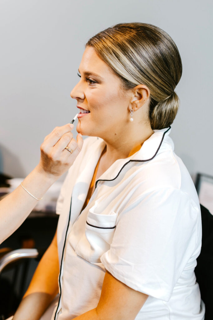 bride getting her wedding day makeup done