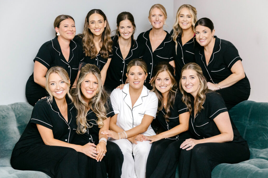 bride with her bridesmaids in matching black & white pajamas